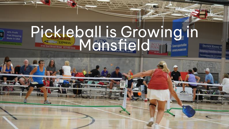 two women playing pickleball